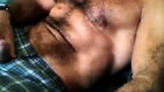 Bearded daddy strokes his cock solo