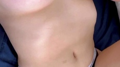 Busty blonde masturbates pussy in a close up photo