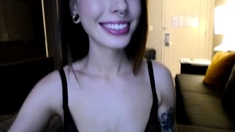 Busty curly brunette with big boobs fucks on couch